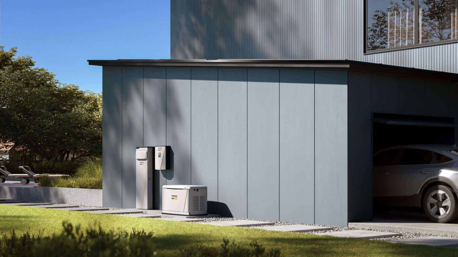 Generac Powercell battery and generator on outside of garage wall with vehicle in garage.